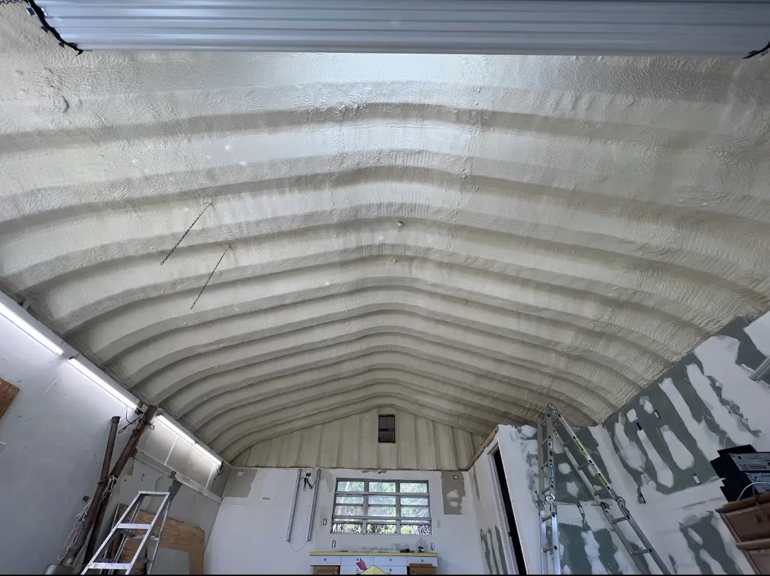 Spray polyurethane foam applied to the underside of a metal roof deck in Lincolnshire